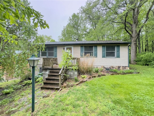 119 Deer Rd, Loyalhanna, PA 15681 - ranch-style house featuring a front yard and a wooden deck