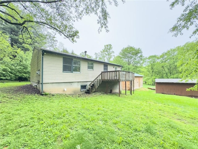 119 Deer Rd, Loyalhanna, PA 15681 - rear view of property featuring a yard, a deck, and stairs