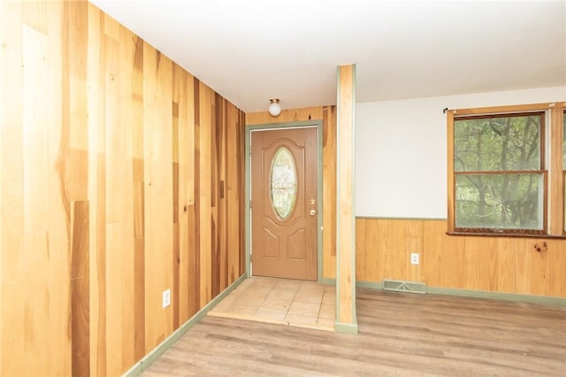119 Deer Rd, Loyalhanna, PA 15681 - foyer with wooden walls, wood finished floors, plenty of natural light, and a wainscoted wall