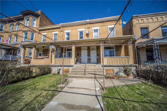 multi unit property featuring a porch