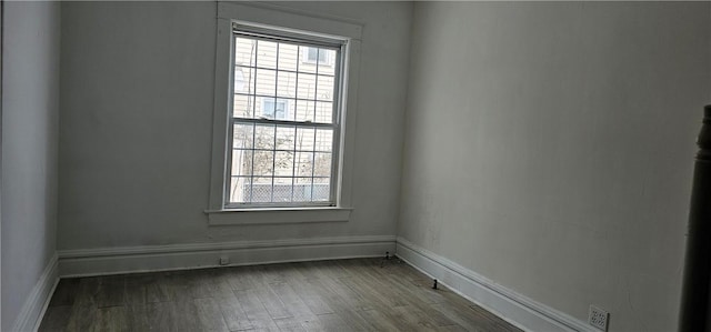 spare room featuring hardwood / wood-style floors