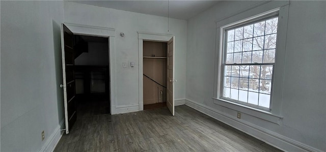 unfurnished bedroom with wood-type flooring