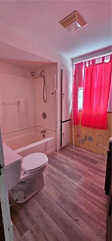 full bathroom featuring vanity, hardwood / wood-style flooring, toilet, and shower / bathtub combination