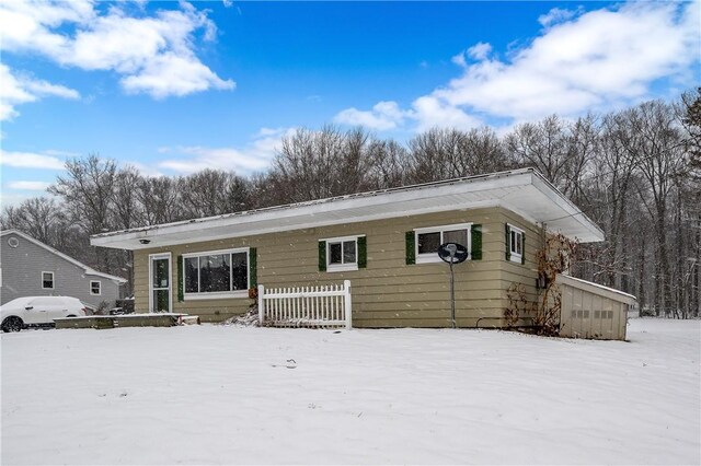 view of snow covered house