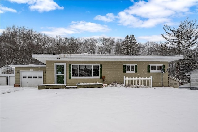 single story home featuring a garage