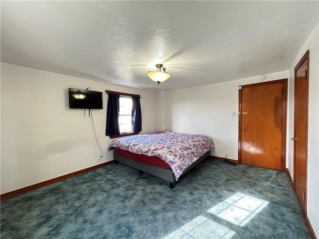 carpeted bedroom featuring a textured ceiling