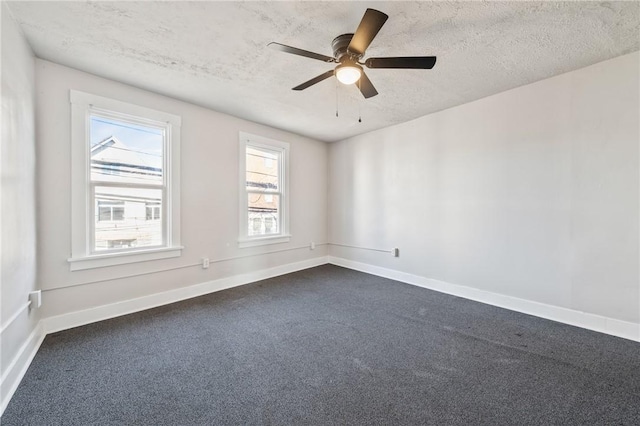 spare room featuring ceiling fan and a textured ceiling