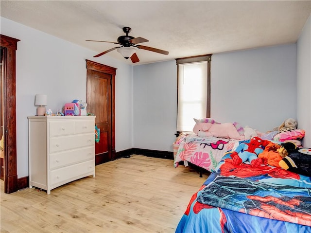 bedroom featuring ceiling fan and light wood-type flooring