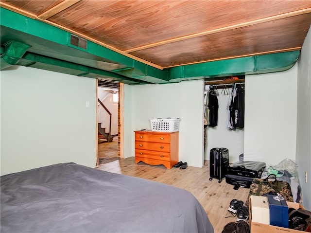 bedroom with hardwood / wood-style floors and wooden ceiling