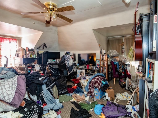 interior space with ceiling fan