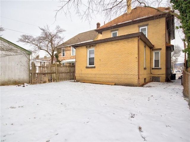 view of snow covered house