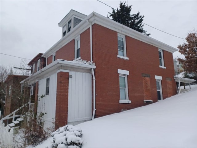 view of snow covered property