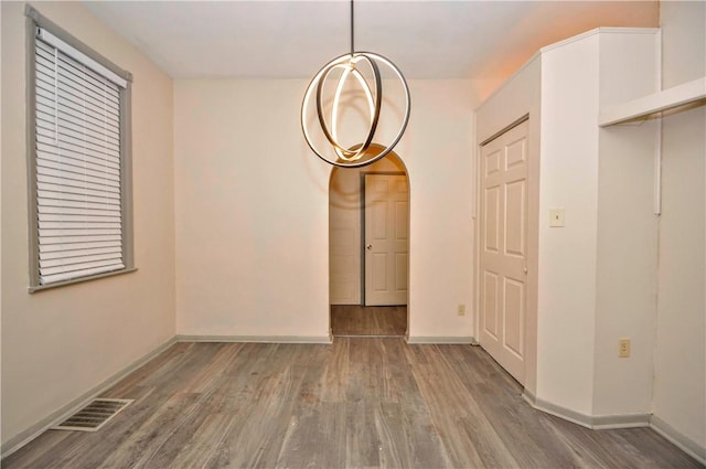 empty room with wood-type flooring