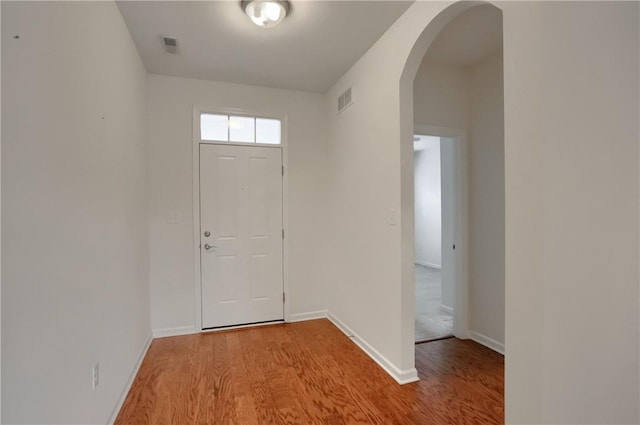 foyer entrance with light hardwood / wood-style floors