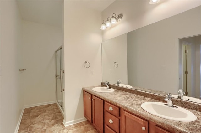 bathroom with vanity and an enclosed shower