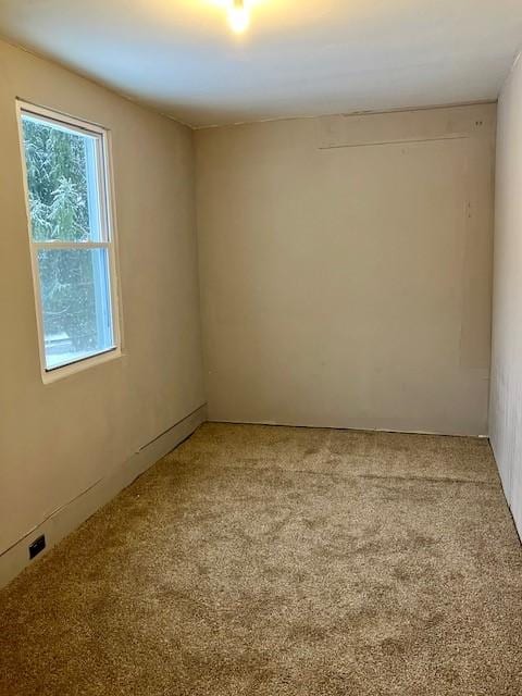 empty room featuring carpet flooring