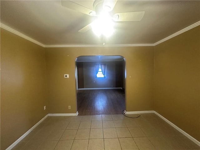 unfurnished room with tile patterned flooring, ceiling fan, and crown molding