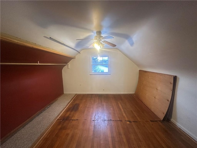 bonus room with dark hardwood / wood-style flooring, ceiling fan, and lofted ceiling