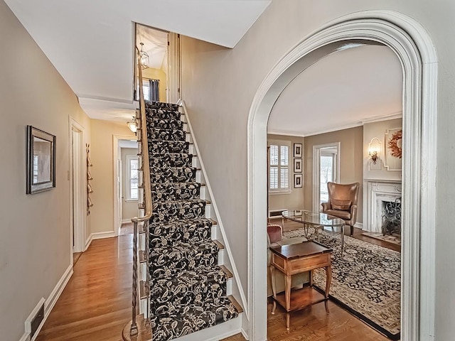 stairway with hardwood / wood-style floors