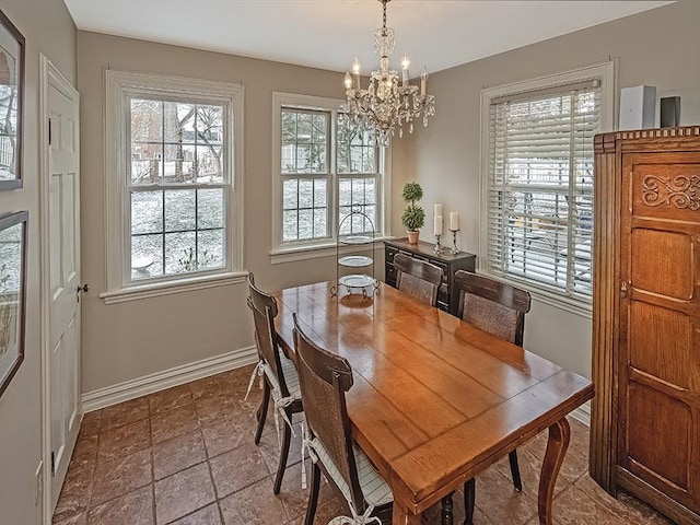 dining area featuring a chandelier