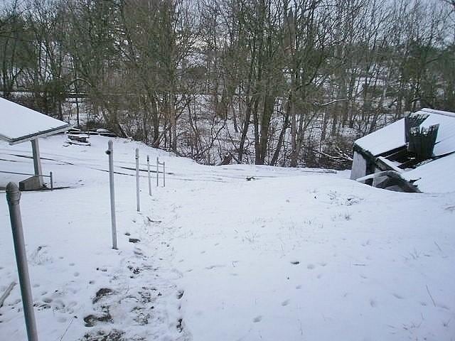 view of yard covered in snow