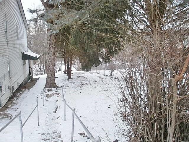 view of yard covered in snow