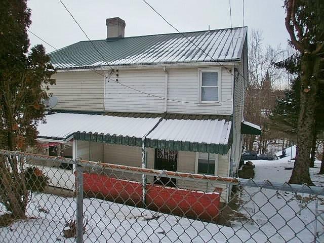 view of snow covered property