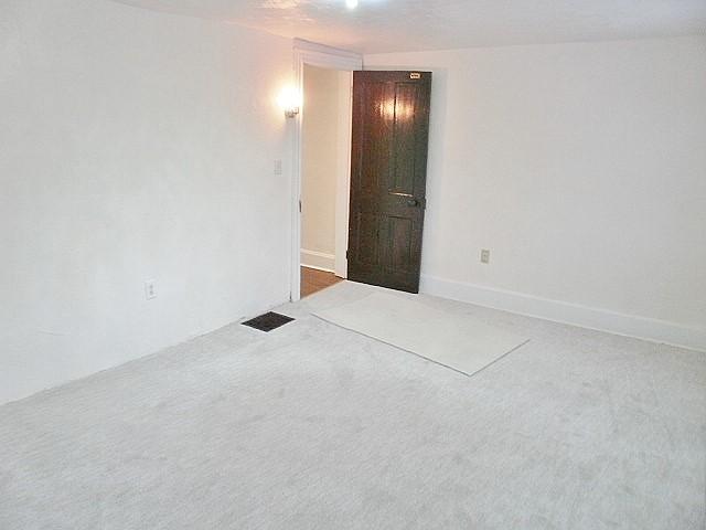 unfurnished room with carpet floors