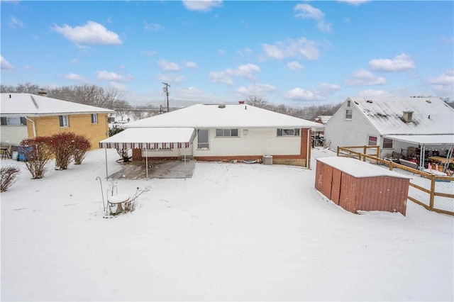 view of snow covered house