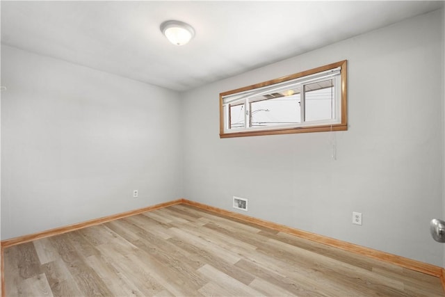 empty room with light wood-type flooring