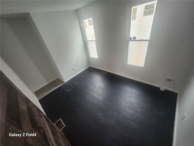 spare room with hardwood / wood-style flooring