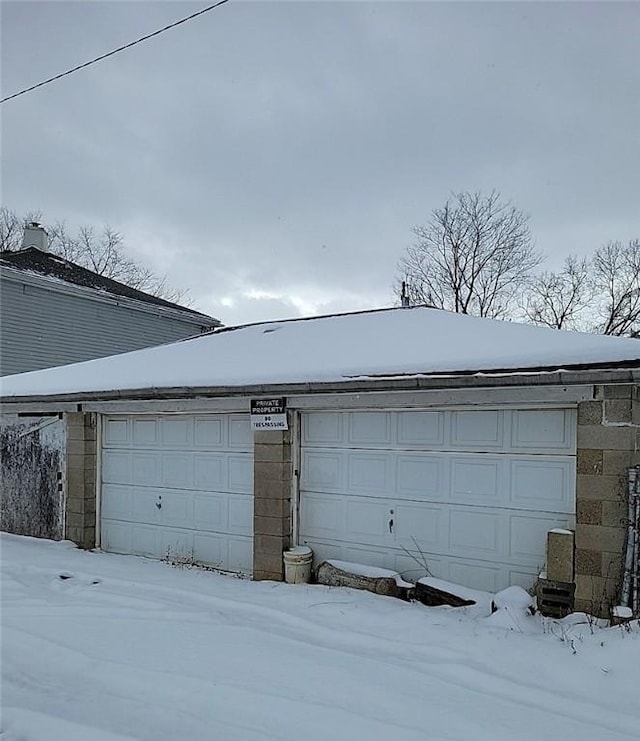 view of snow covered garage