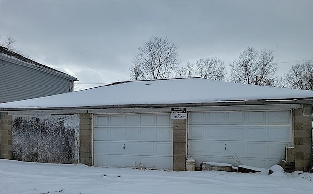 view of snow covered garage