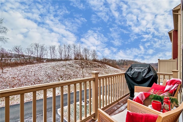 snow covered deck with area for grilling