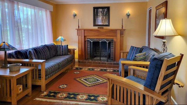 living room with hardwood / wood-style flooring, crown molding, and a wealth of natural light