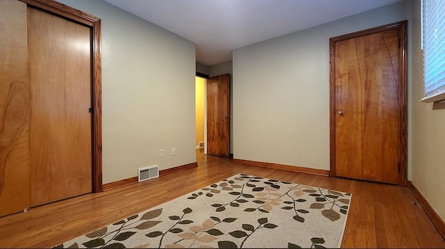 bedroom featuring a closet and light hardwood / wood-style floors