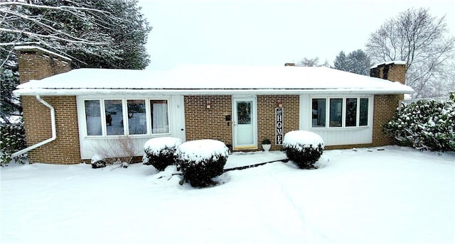 view of snow covered house