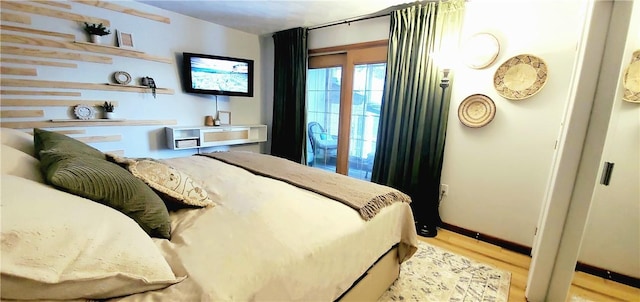 bedroom with light wood-type flooring