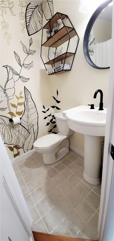 bathroom featuring tile patterned floors and toilet