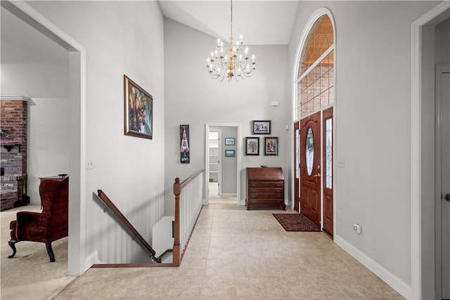 tiled foyer entrance with a chandelier and lofted ceiling