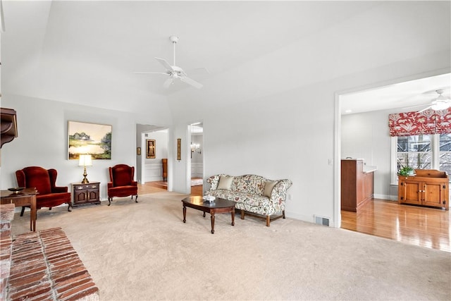 living room with light carpet and ceiling fan