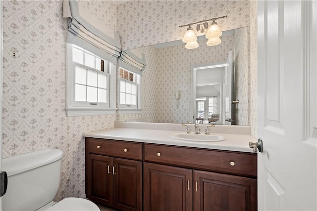 bathroom featuring vanity and toilet