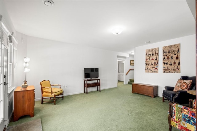 sitting room featuring carpet floors