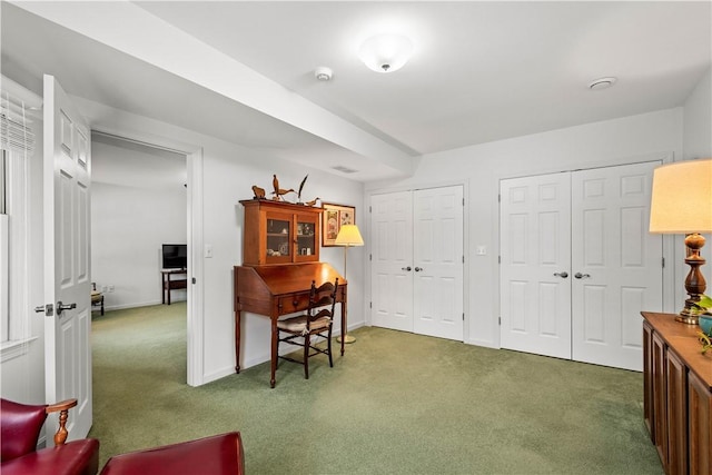 office area featuring dark colored carpet