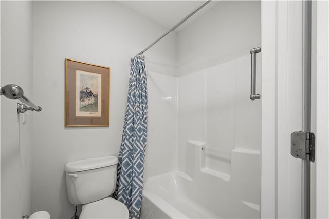 bathroom with toilet and shower / bath combo with shower curtain