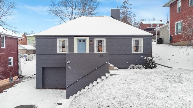 view of snow covered house