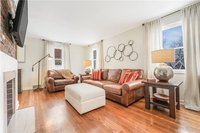 living room with light hardwood / wood-style flooring