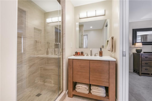 bathroom with vanity and an enclosed shower