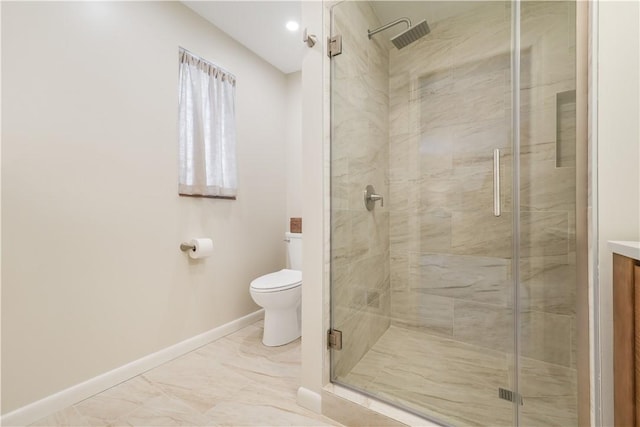 bathroom with toilet and a shower with shower door