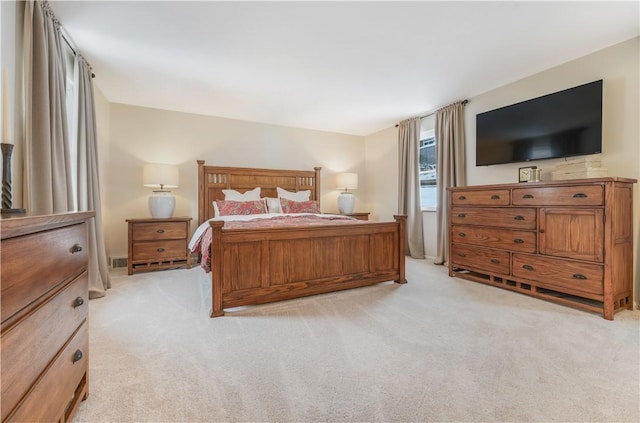 bedroom with light colored carpet